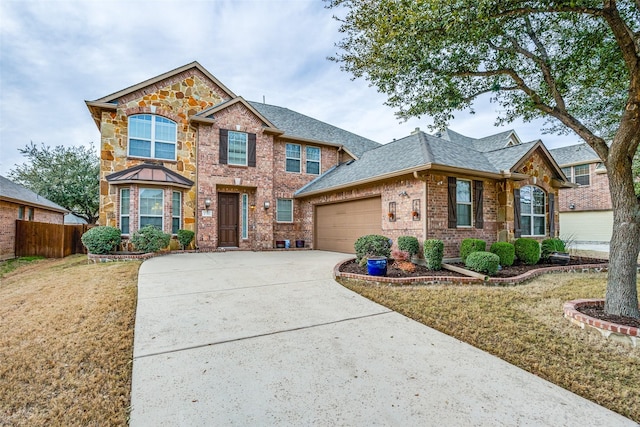 view of front of property with a garage and a front yard