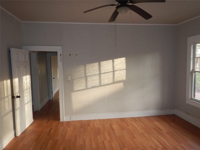 spare room with ceiling fan, ornamental molding, and hardwood / wood-style floors