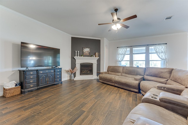 living room with crown molding, ceiling fan, and dark hardwood / wood-style floors