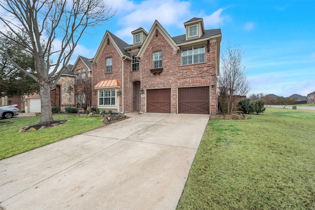 view of front facade featuring a garage and a front yard