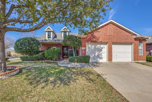 view of front of house featuring a front lawn and a garage