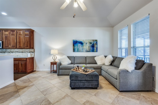 tiled living room with ceiling fan