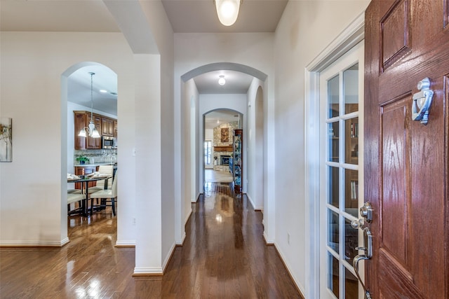 corridor featuring dark hardwood / wood-style floors