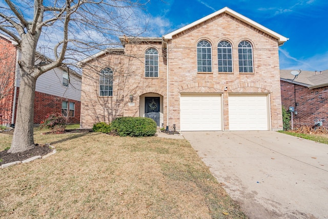 front of property featuring a garage and a front yard