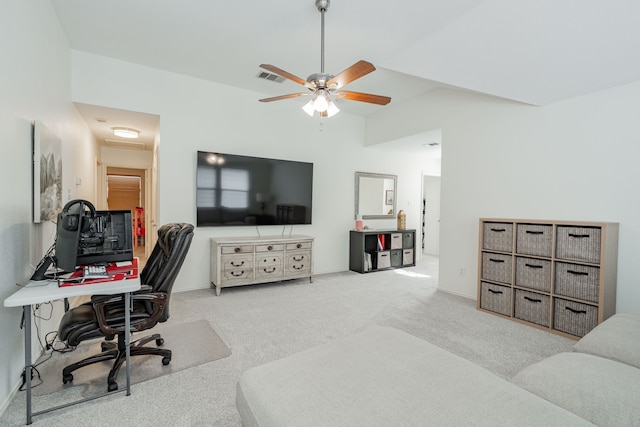 office with ceiling fan, light colored carpet, and lofted ceiling