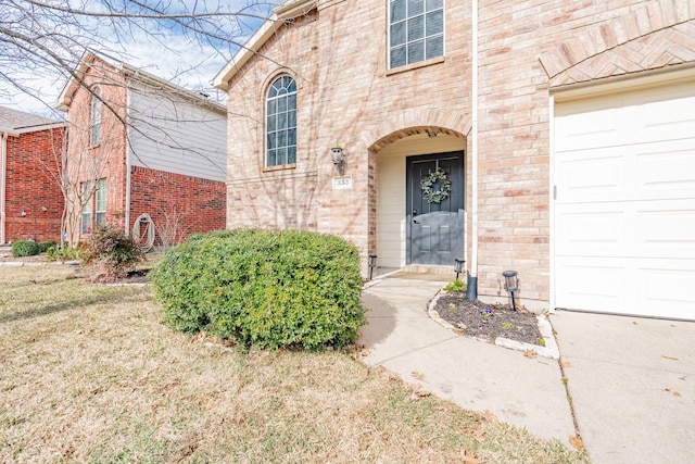 entrance to property with a yard