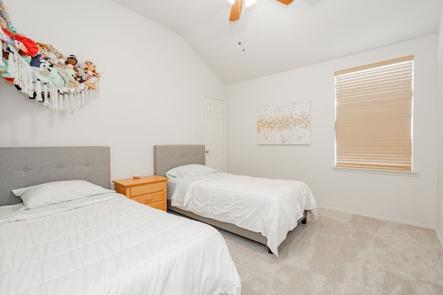 carpeted bedroom with lofted ceiling and ceiling fan