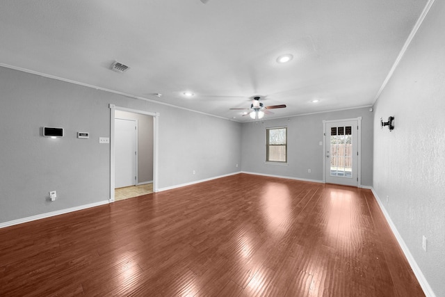 interior space with ceiling fan, ornamental molding, and light wood-type flooring