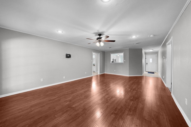 unfurnished living room with hardwood / wood-style floors, crown molding, and ceiling fan