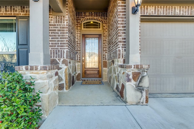 entrance to property featuring brick siding