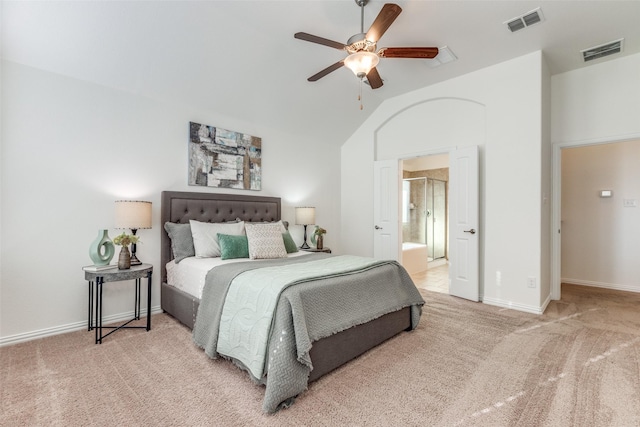 carpeted bedroom featuring connected bathroom, visible vents, baseboards, and ceiling fan