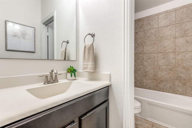 full bath with shower / bathing tub combination, toilet, vanity, and tile patterned flooring