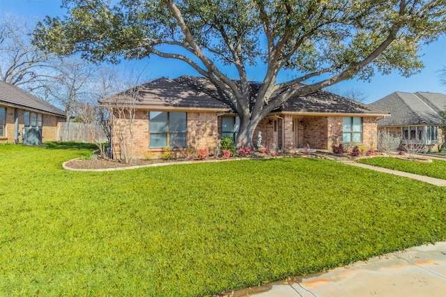 single story home with a front yard