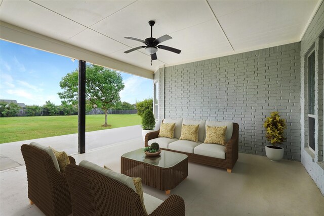 view of patio / terrace featuring ceiling fan and an outdoor living space