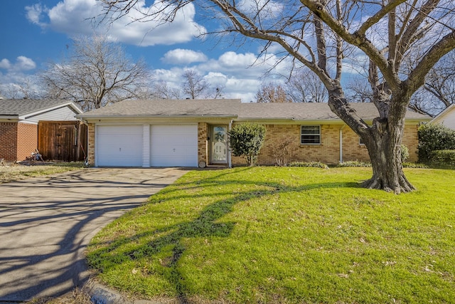 ranch-style home with a garage and a front yard