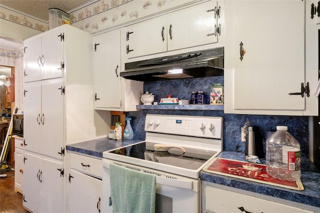 kitchen featuring white range with electric cooktop, white cabinetry, tasteful backsplash, wood-type flooring, and a textured ceiling