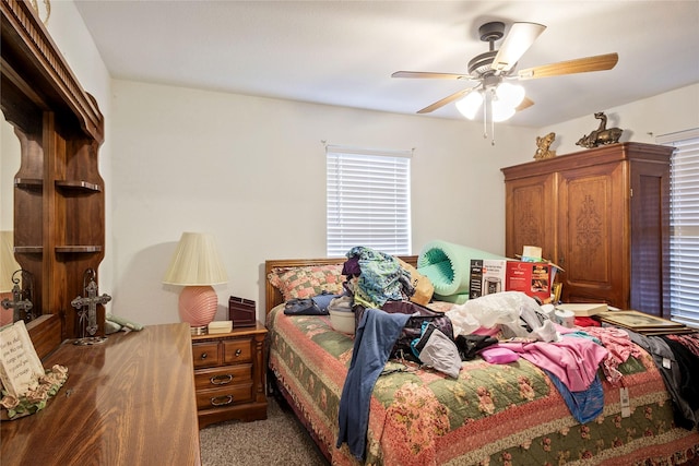 bedroom with ceiling fan and carpet floors