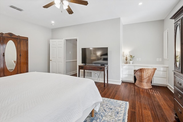 bedroom with dark hardwood / wood-style floors and ceiling fan