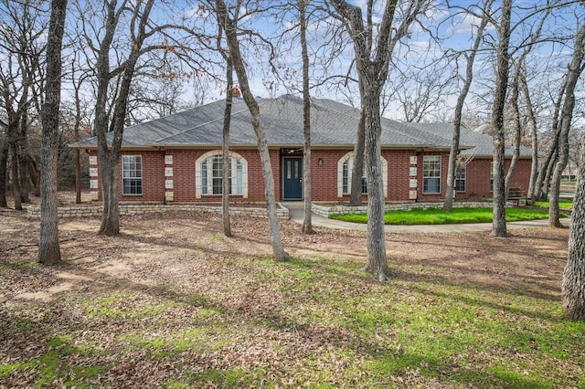 ranch-style house with a front lawn