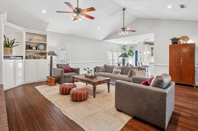 living room with dark wood-type flooring, ceiling fan, and high vaulted ceiling