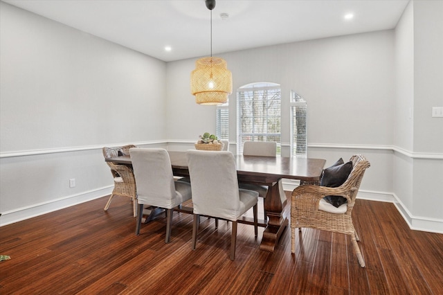 dining space with dark wood-type flooring