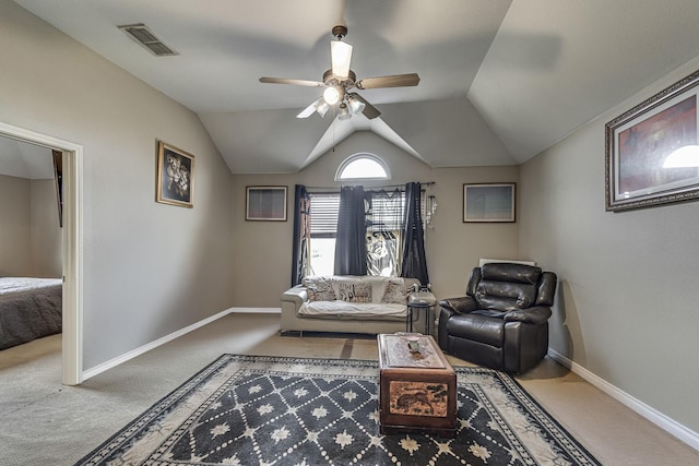 carpeted living room with visible vents, baseboards, a ceiling fan, and vaulted ceiling