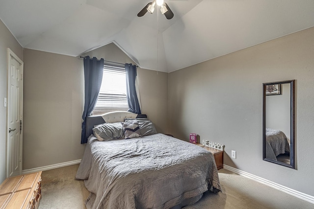 bedroom with baseboards, carpet floors, ceiling fan, and vaulted ceiling