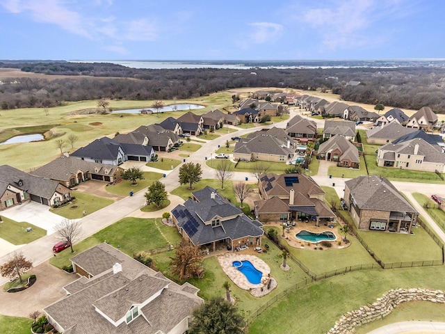 bird's eye view featuring a residential view and a water view