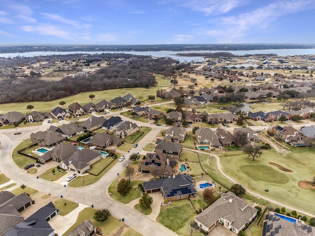 birds eye view of property with a residential view and a water view