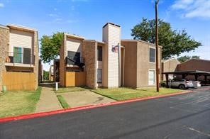 5540 Boca Raton Blvd Unit 174, Fort Worth, TX 76112 - view of front facade with covered parking and stucco siding