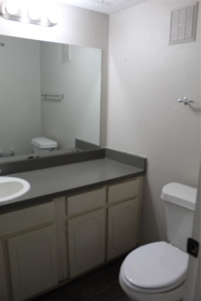 5540 Boca Raton Blvd Unit 174, Fort Worth, TX 76112 - half bathroom with vanity and wood finished floors