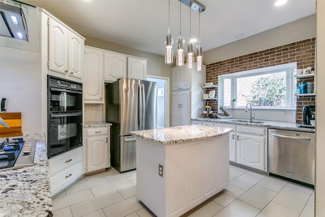 kitchen with black appliances, a kitchen island, decorative light fixtures, and white cabinets