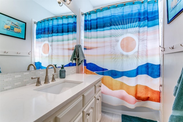 bathroom with tasteful backsplash, a shower with shower curtain, and vanity