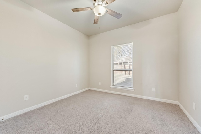 empty room featuring carpet floors and ceiling fan