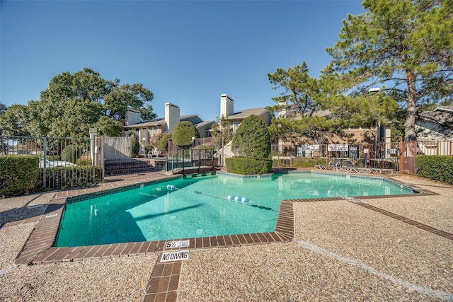 view of pool featuring a patio