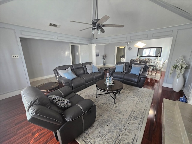 living room featuring ceiling fan, wood-type flooring, and high vaulted ceiling