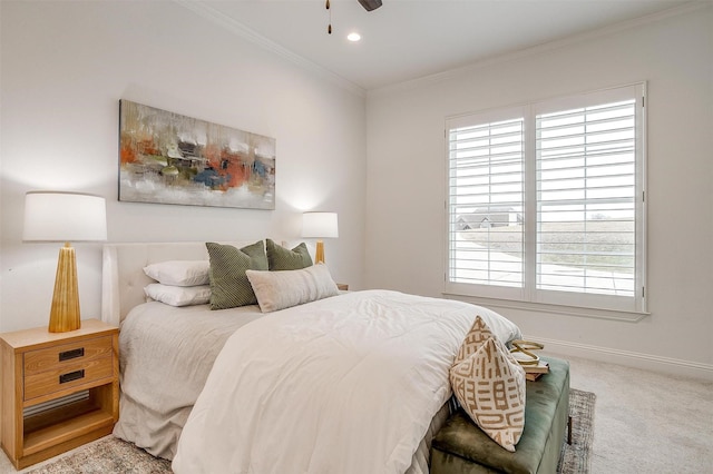 bedroom featuring ornamental molding, ceiling fan, and carpet