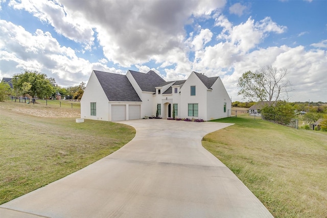 view of front of property with a garage and a front yard