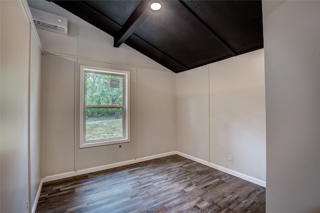 empty room with dark hardwood / wood-style floors, lofted ceiling with beams, and a wall unit AC