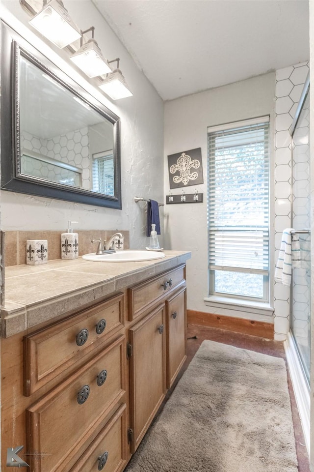 bathroom featuring vanity and a healthy amount of sunlight