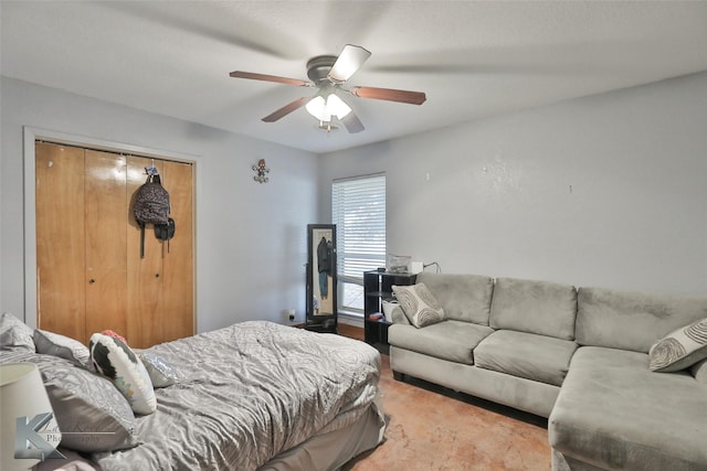 bedroom with ceiling fan and a closet