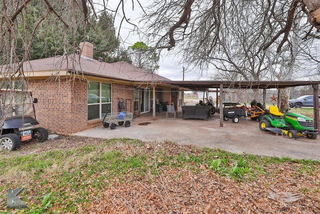 rear view of property with an outdoor hangout area