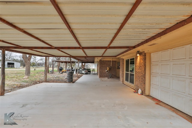 view of patio / terrace with a carport