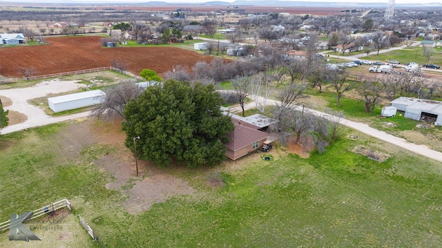 birds eye view of property with a rural view