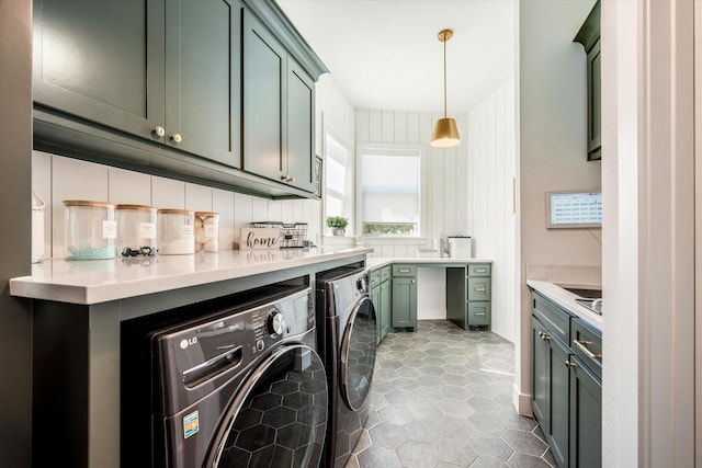 laundry area with cabinet space and washer and clothes dryer