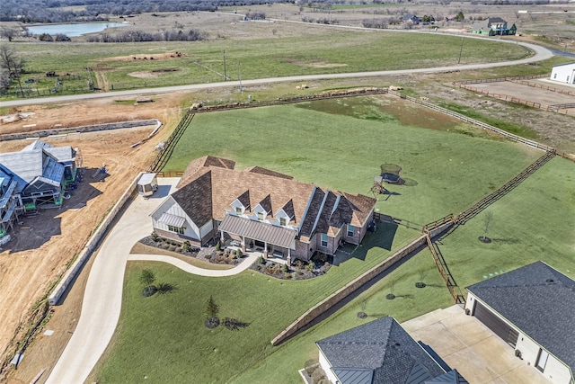 aerial view with a water view and a rural view