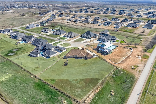 birds eye view of property with a residential view