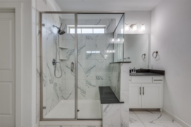 bathroom with vanity and a shower with door