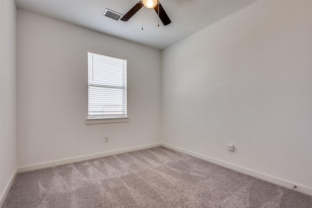 spare room with ceiling fan and carpet flooring