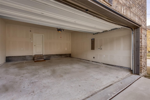 garage featuring a garage door opener and electric panel